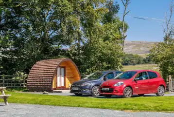 Camping pods with parking spaces