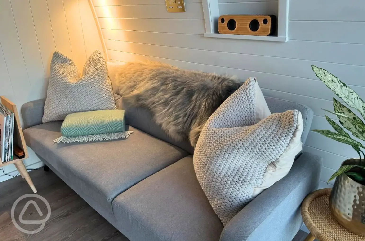 Sildvik and Sunset ensuite glamping pod interiors with a sofa