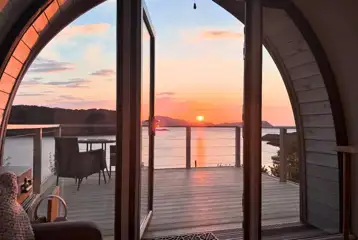 Sildvik and Sunset ensuite glamping pods with loch views at sunset Sildvik and Sunset ensuite glamping pods with loch views at sunset