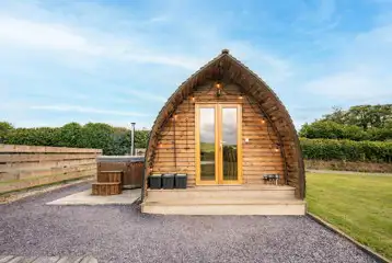 Glamping pod with a private wood-fired hot tub