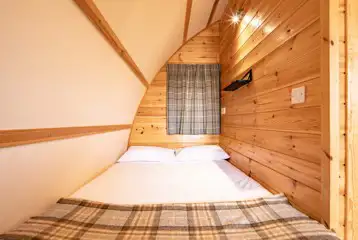 Glamping pod double bed in an alcove area