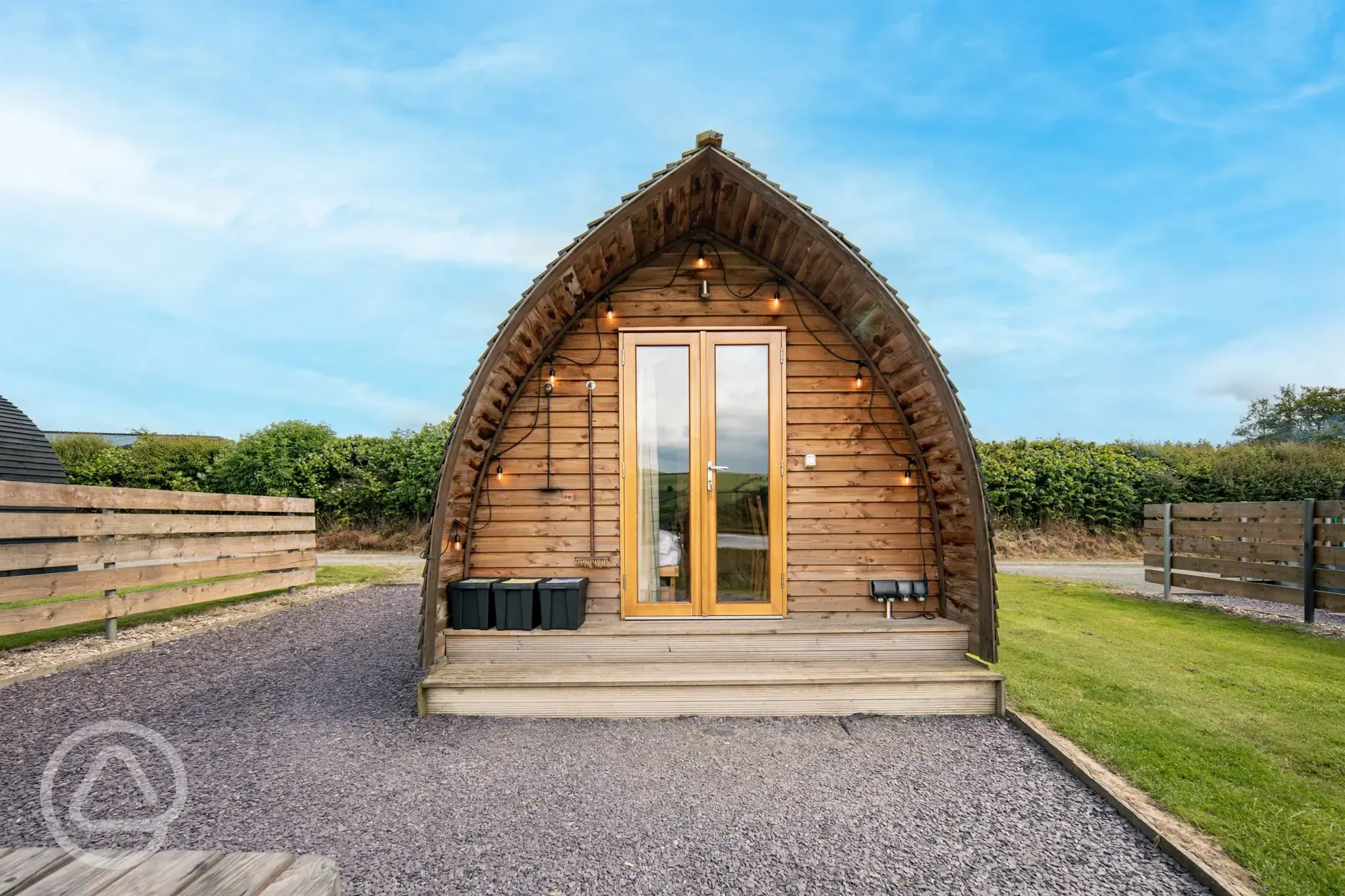 Glamping pod with outdoor lighting and double doors