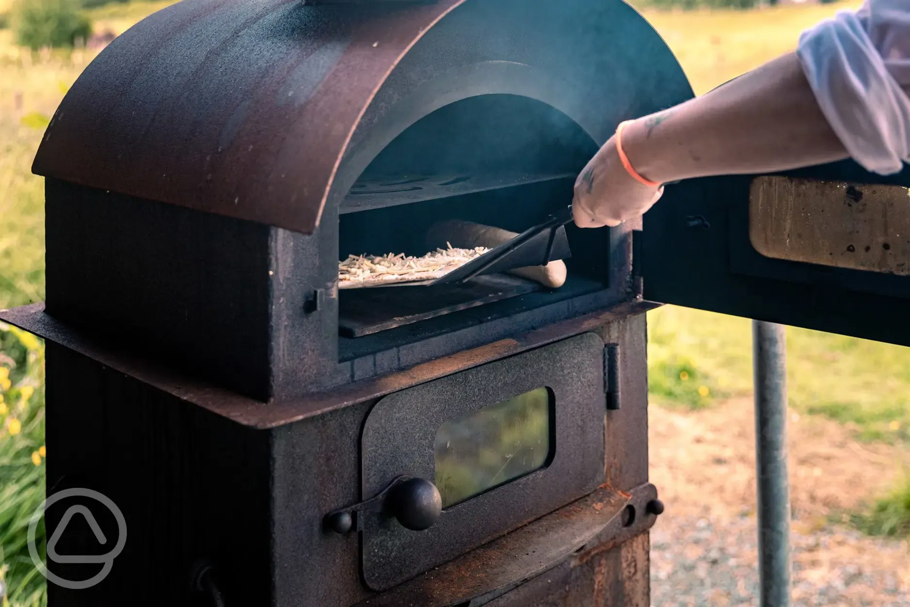 Communal sheltered area with a pizza oven