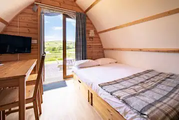 Glamping pod sofa bed made up