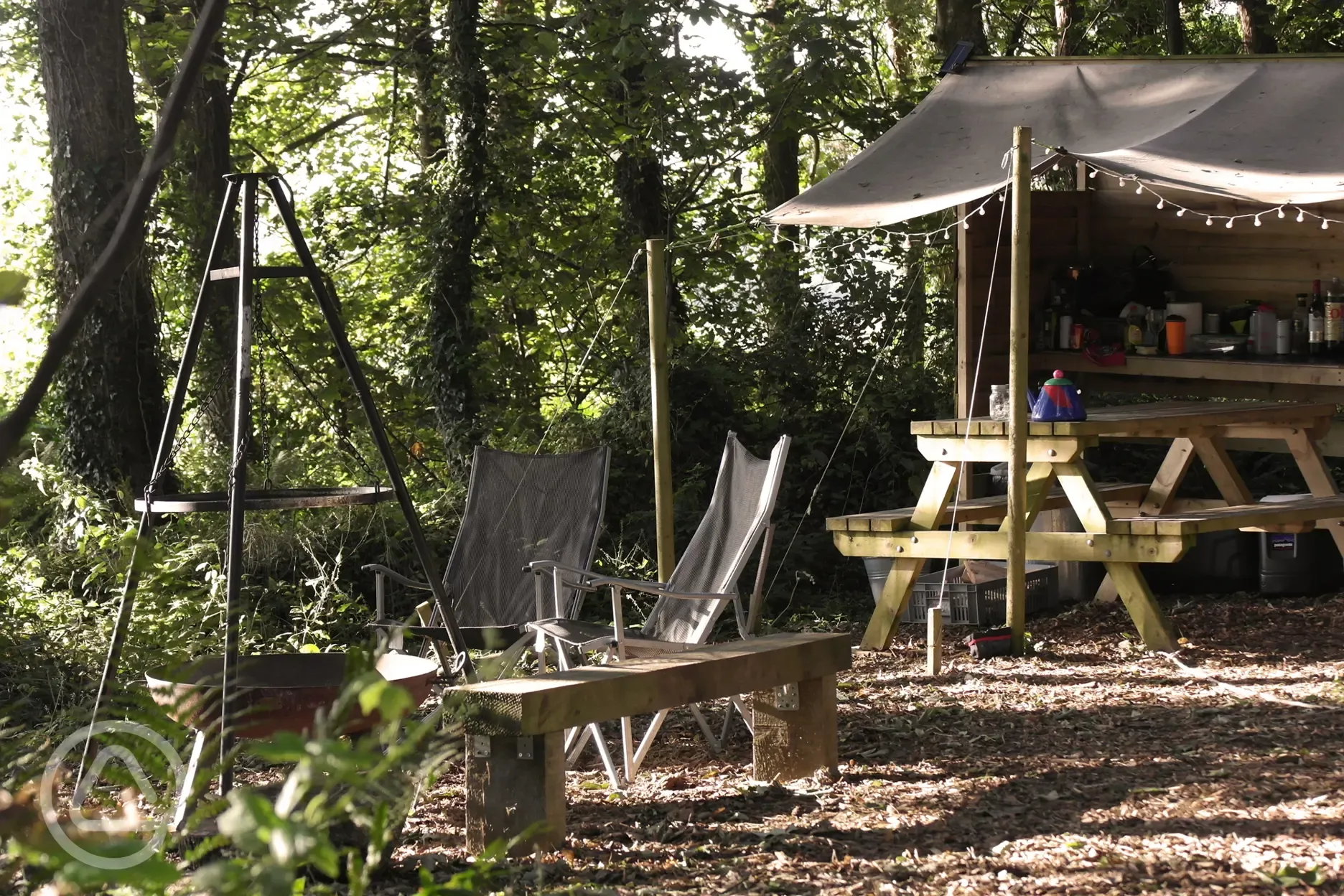 Private covered outdoor camping kitchen area and fire pit