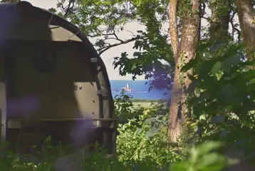 Landpod overlooking Godrevy Lighthouse from Wildflower Wood at Beersheba Farm