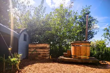 Peacock camping pod with hot tub