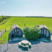 Aerial of Cennin Pedr and Pabi glamping pods with hot tubs