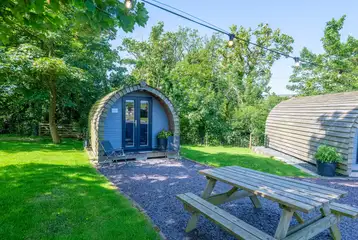 Meillion glamping pod with string lighting and outdoor seating Meillion glamping pod with string lighting and outdoor seating