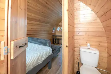 Four person pod ensuite bathroom with a toilet, shower and hand basin Four person pod ensuite bathroom with a toilet, shower and hand basin