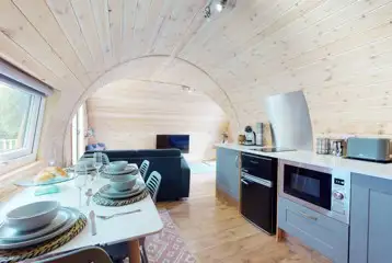 Llys Y Llwynogod pod open plan space with a fully equipped kitchenette