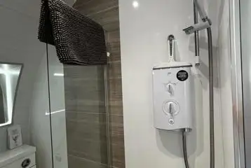 Glamping pod ensuite wetroom bathroom with an electric shower Glamping pod ensuite wetroom bathroom with an electric shower