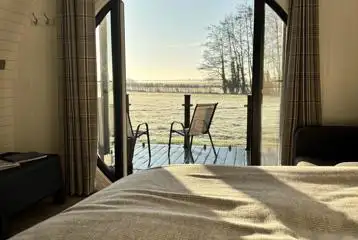 Glamping pod countryside views through double glass doors Glamping pod countryside views through double glass doors