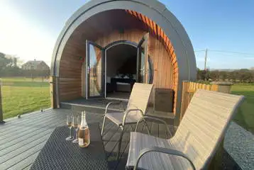 Ensuite glamping pods with glass side decking areas Ensuite glamping pods with glass side decking areas