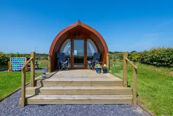 Ensuite glamping pod exterior with private decking Ensuite glamping pod exterior with private decking