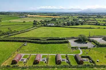 Aerial of Podiau Mon and views of Snowdonia