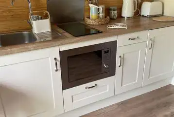 Ensuite glamping pod kitchenette with microwave, kettle and toaster Ensuite glamping pod kitchenette with microwave, kettle and toaster