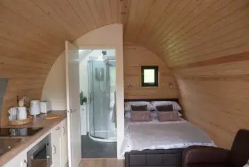 Ensuite glamping pod interior (bedding provided) Ensuite glamping pod interior (bedding provided)