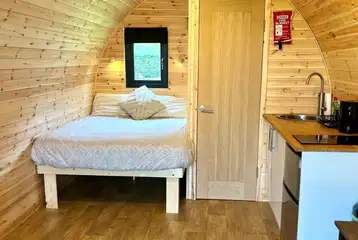 Luxury pod with a double bed, ensuite and kitchen
