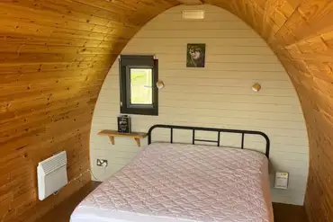 Camping pod with a double bed and sofa bed