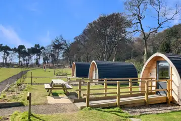 Camping pods with picnic benches
