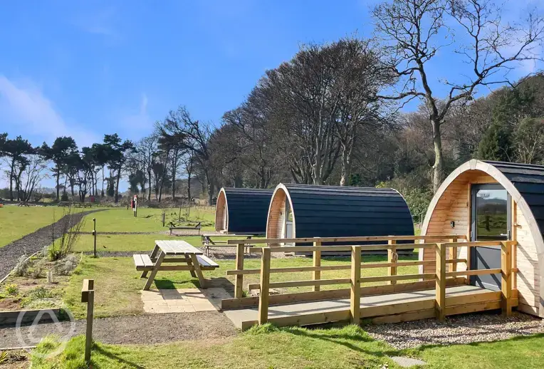 Camping pods with picnic benches