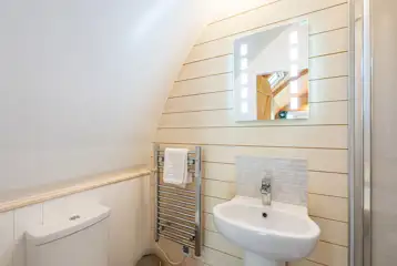 Glamping pod ensuite with shower, toilet and sink