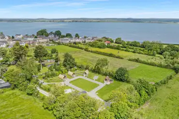 Aerial of the glamping pods and the Solway Coast