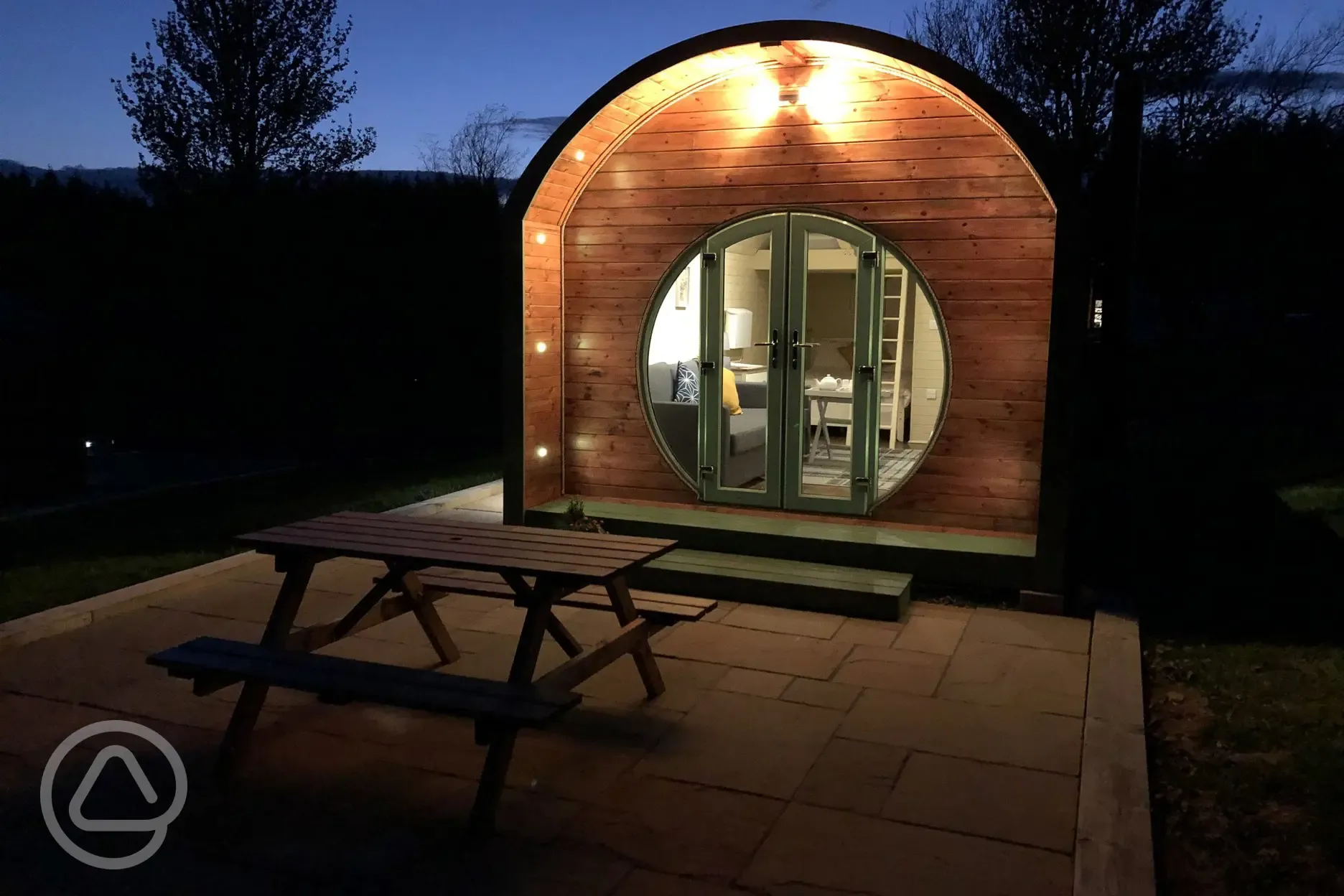 Family glamping pod at night