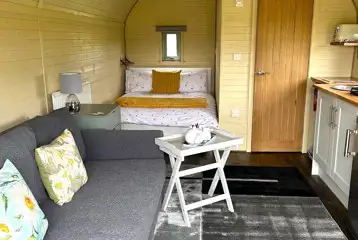 Adult only glamping pod with hot tub interior with double bed, ensuite and sofa Adult only glamping pod with hot tub interior with double bed, ensuite and sofa