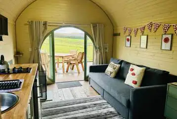 Adult only glamping pod with hot tub interior with sofa, kitchenette and decking Adult only glamping pod with hot tub interior with sofa, kitchenette and decking