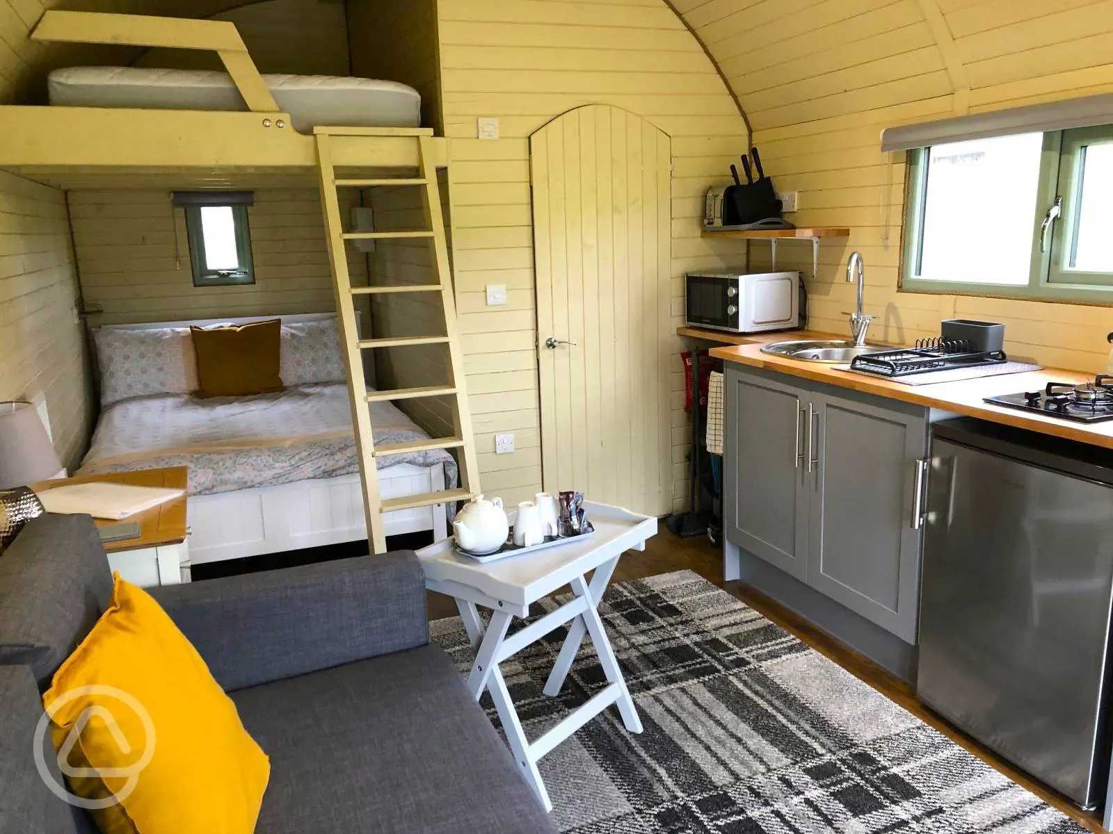 Family glamping pod with double bed, bunk beds, kitchenette and ensuite