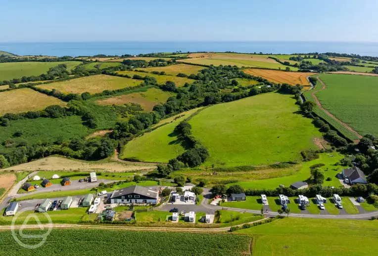Aerial of The Oaks Holiday Park towards Millendreath and the coast