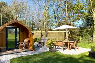 Bracken glamping pod with a barrel hot tub at The Paddock Pods at Homeland
