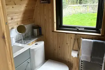 Ensuite bathrooms with a toilet and small mirror