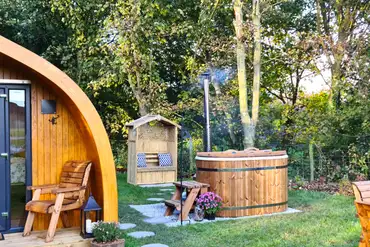 Bracken glamping pod hot tub and outdoor seating area
