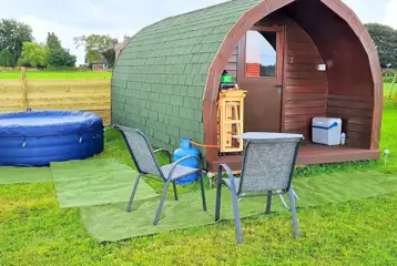 Camping pod with a private Lay-Z Spa hot tub and outdoor gas stove