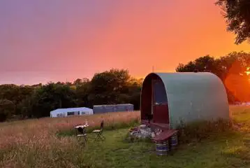 Camping pod at sunset