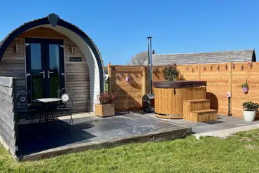Luxury ensuite glamping pod with wood-fired hot tub hydro spa