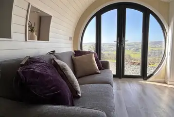 Usk glamping pod living area with a sofa bed Usk glamping pod living area with a sofa bed