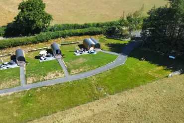 Aerial of Great House Farm, backed by a hedgerow