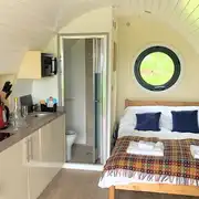 Three person (Chwefru and Irfon) interior with a double bed and sofa bed Three person (Chwefru and Irfon) interior with a double bed and sofa bed