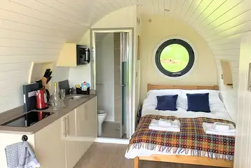 Three person (Chwefru and Irfon) interior with a double bed and sofa bed Three person (Chwefru and Irfon) interior with a double bed and sofa bed