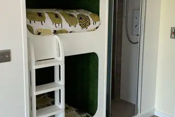 Six person (Wye) pod with a set of bunk beds Six person (Wye) pod with a set of bunk beds