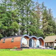 Eight person (Severn) pod with a patio and covered hot tub