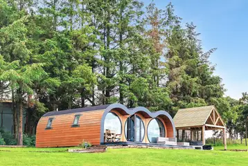 Eight person (Severn) pod with a patio and covered hot tub