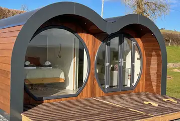 Usk (eight person) glamping pod with a double glass front Usk (eight person) glamping pod with a double glass front