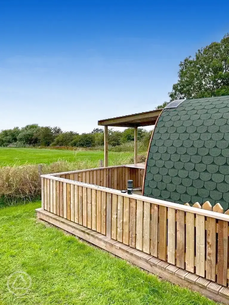 Glamping pod covered outdoor area with countryside views