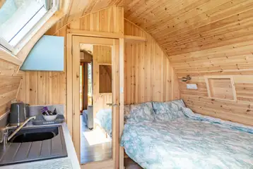 Four person pod double bed and kitchenette