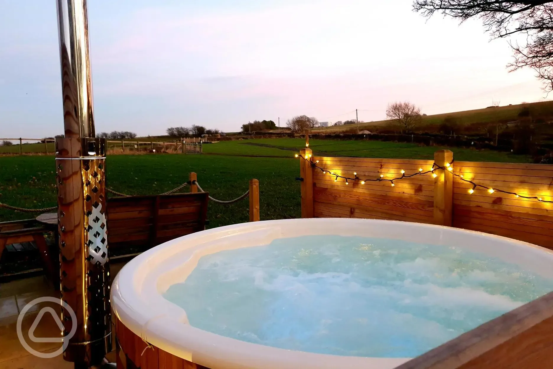 Glamping pod hot tub at night